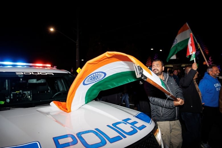 Members of Brampton’s Hindu community hold a rally, blocking traffic, near the Hindu Sabha temple on Nov. 4, 2024.