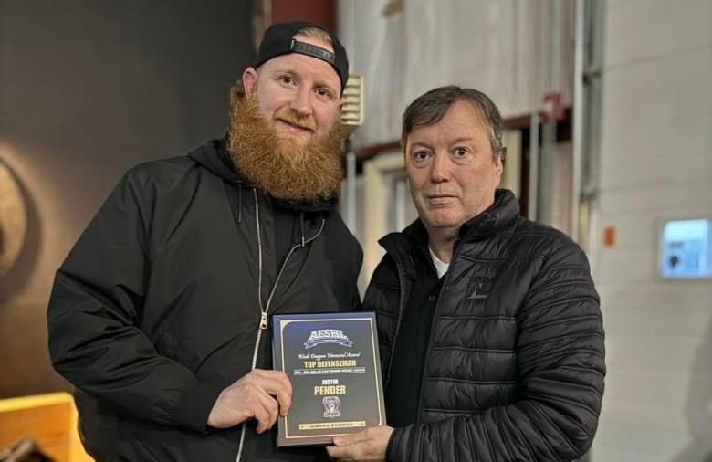 Justin Pender receiving an award